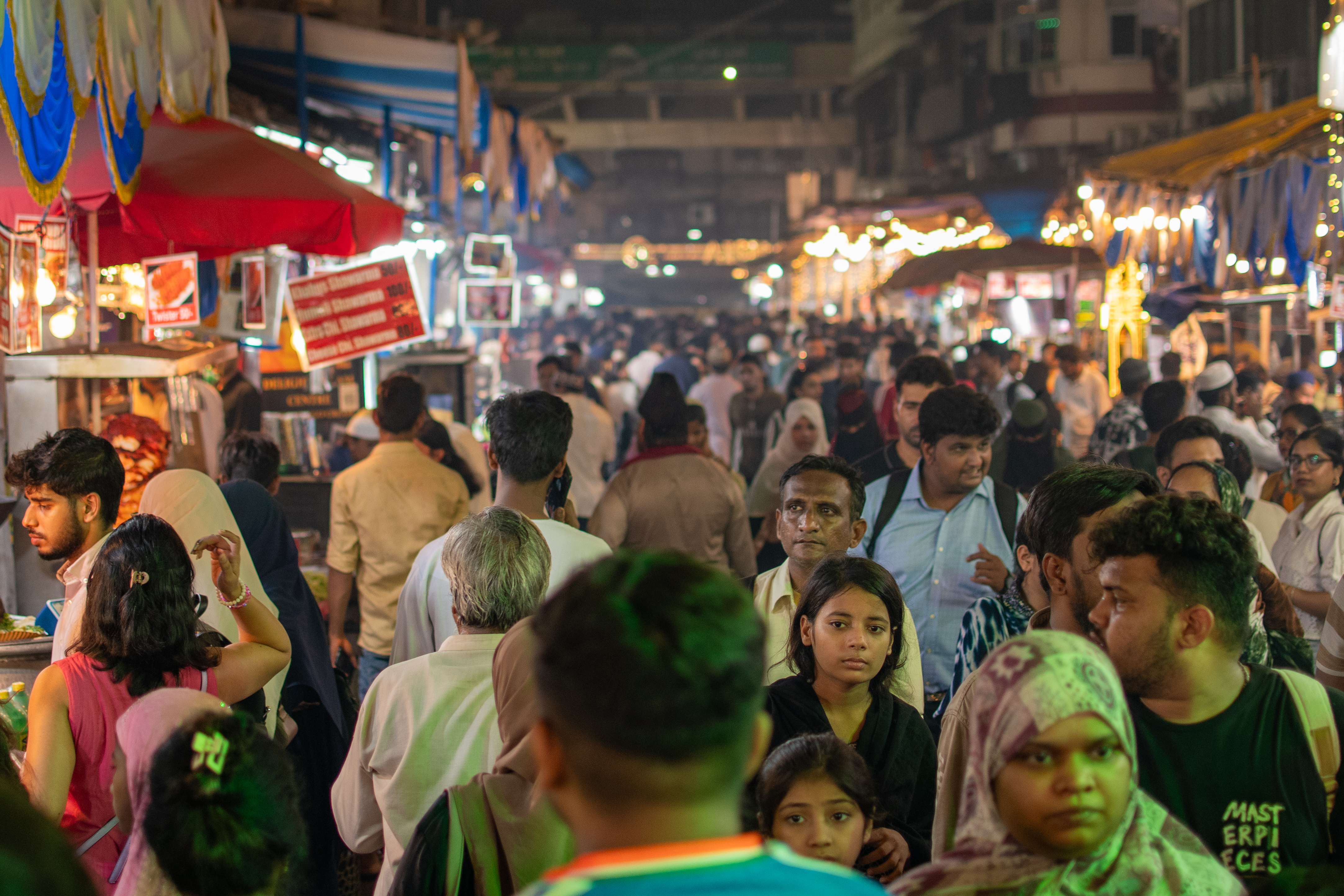 Mohammed Ali Road at full release - hundreds of people eating and moving through the lit street