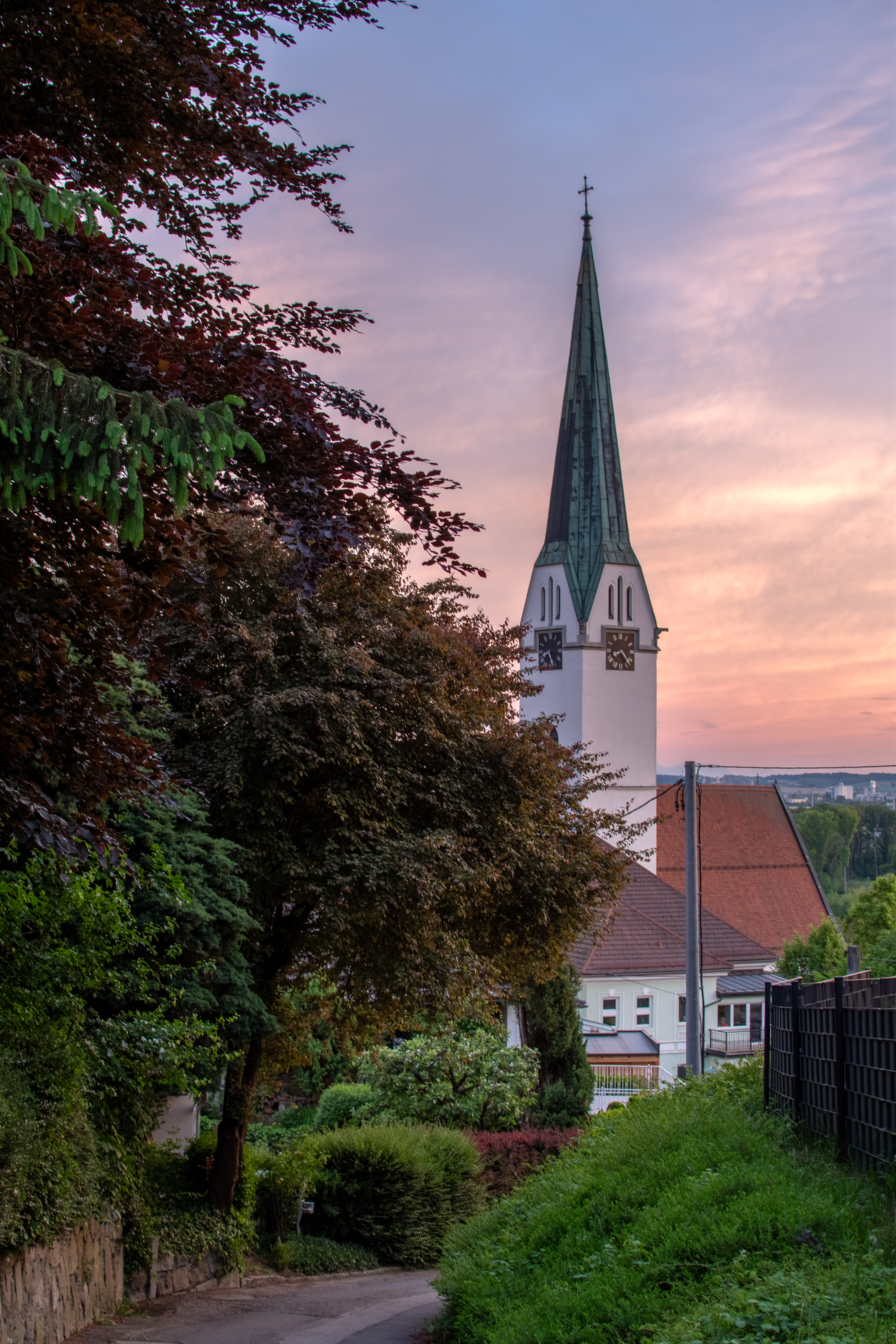 St. Nicholas parish church in Mauthausen at golden hour sunset