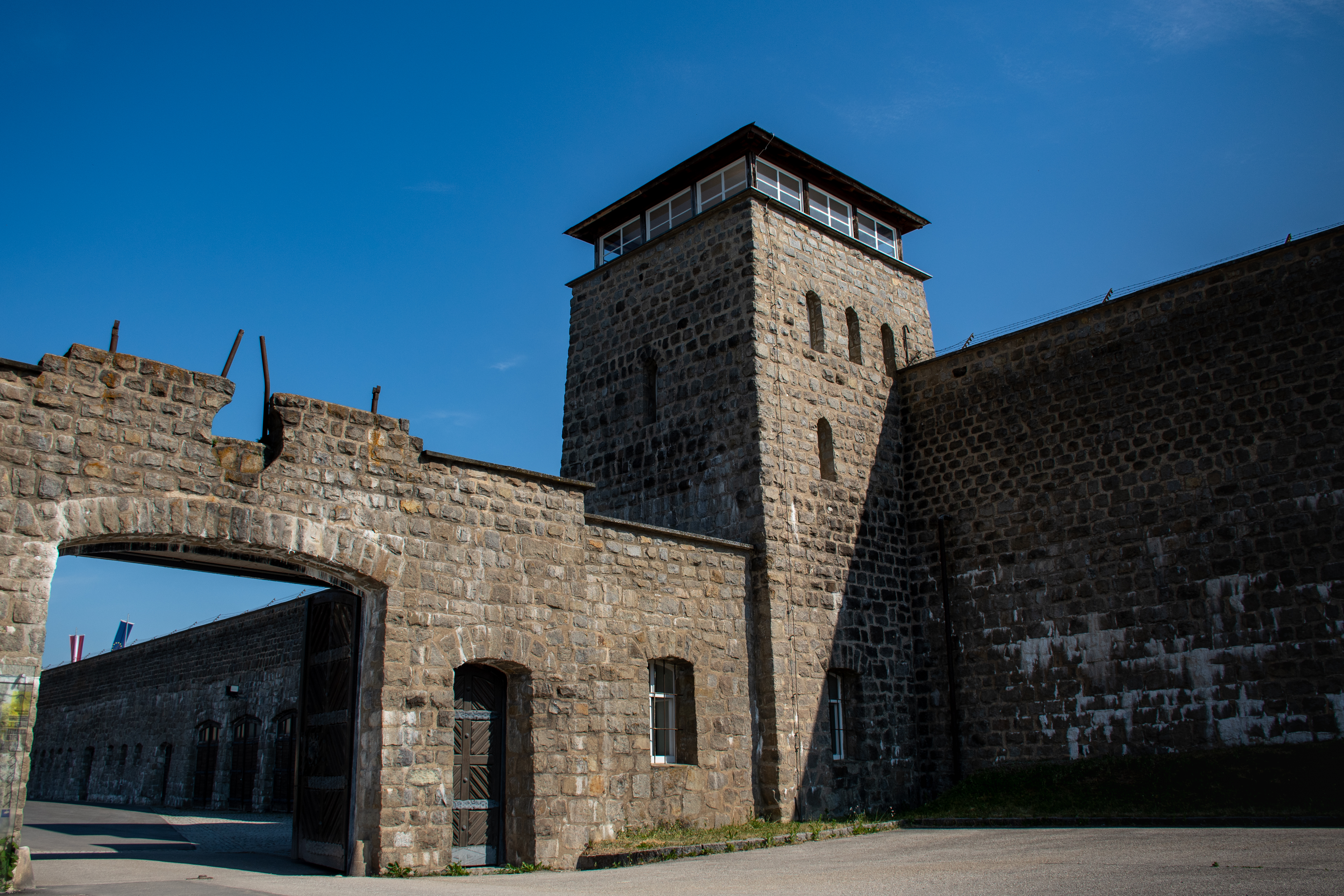 Mauthausen main entrance gate and guard tower in morning light