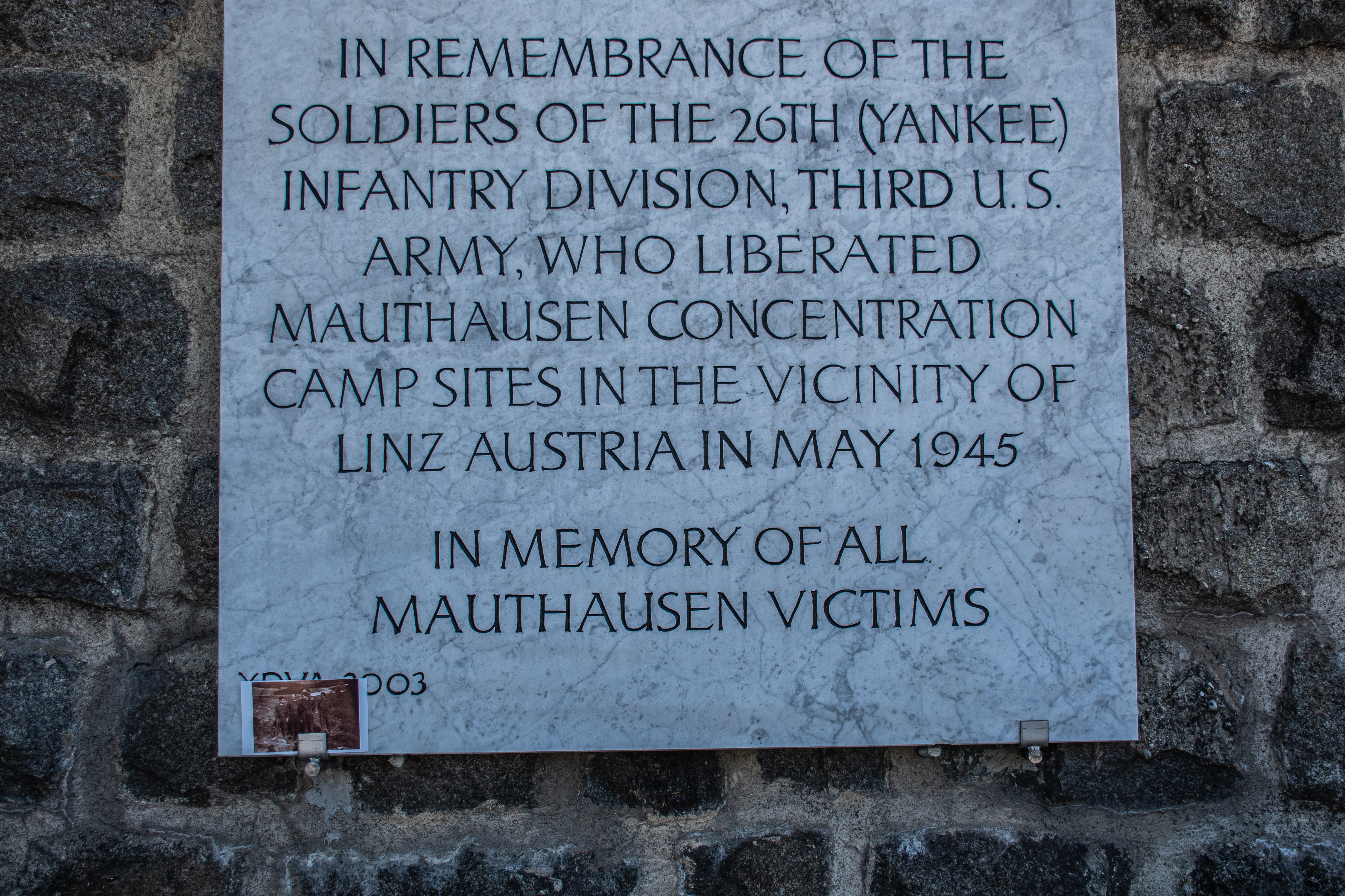 US 26th Infantry Division liberator memorial at Mauthausen with grandfather's photo placed at the base