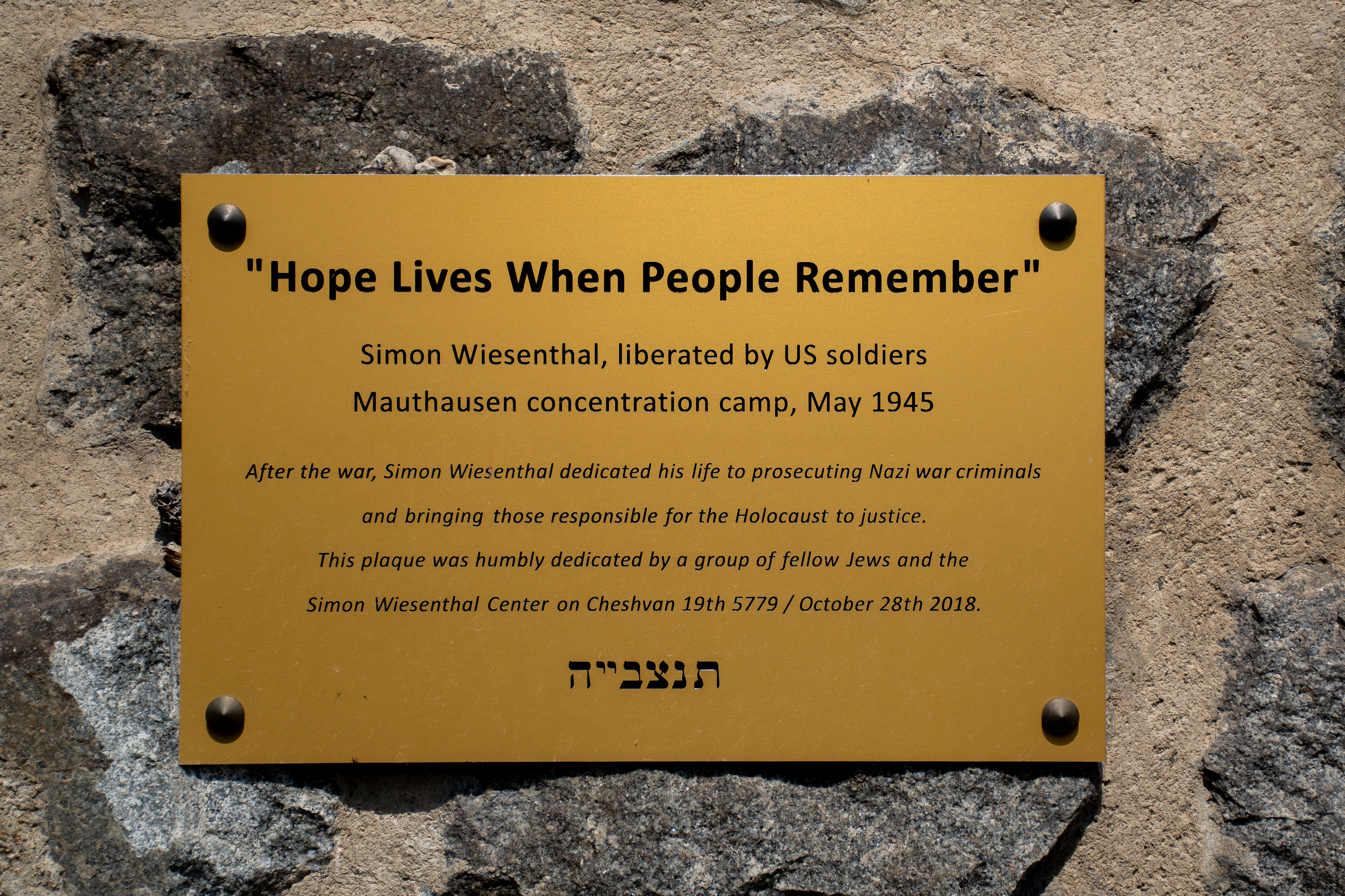 Hope Lives When People Remember plaque inside Mauthausen