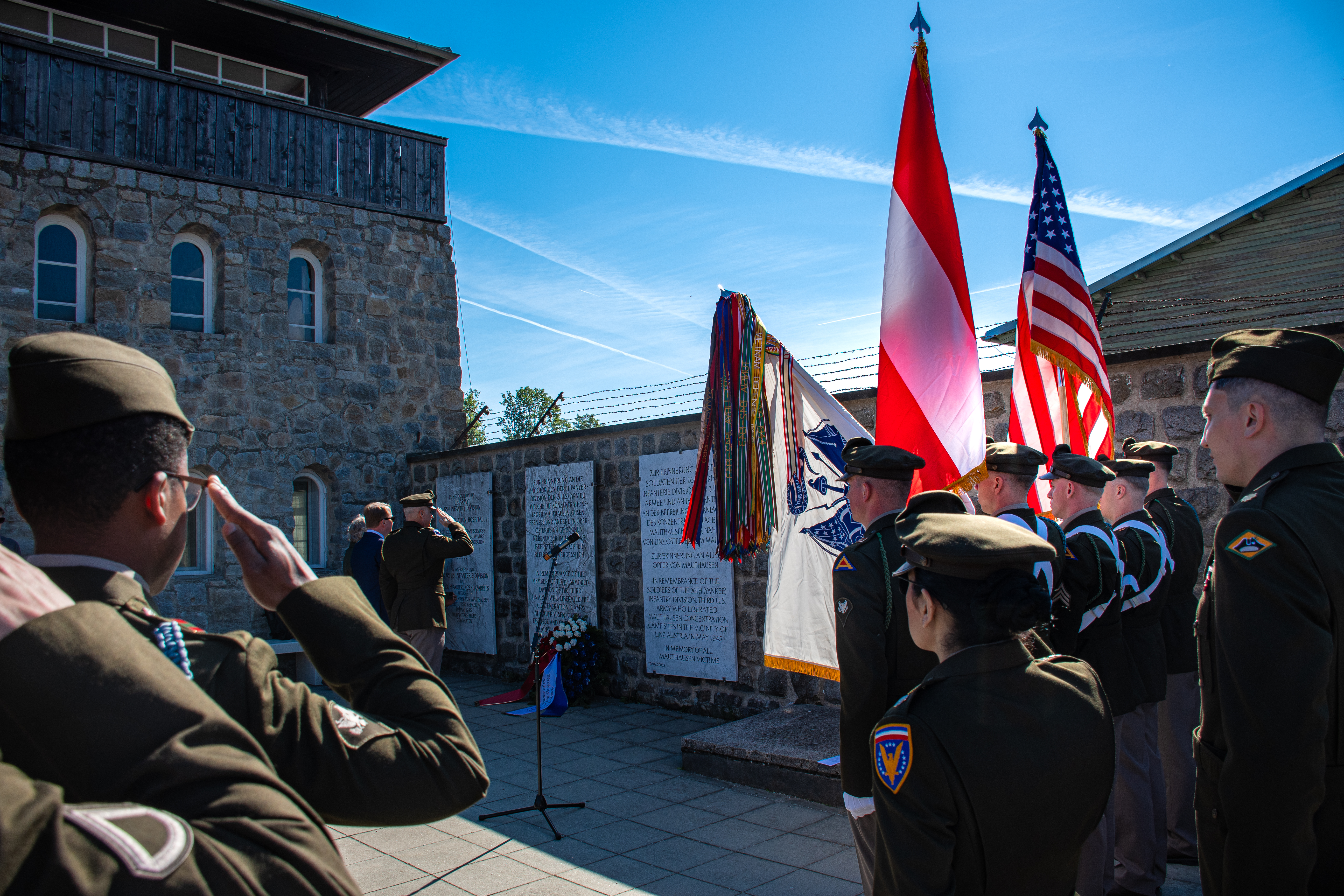 7th Army soldiers saluting at the US memorial at Mauthausen