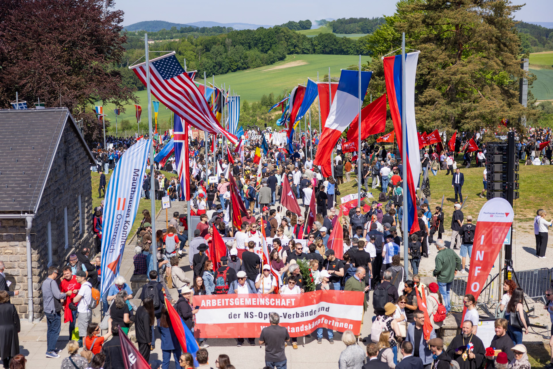 Aerial view of the international crowd gathering at the Mauthausen roll-call gates for the 81st liberation ceremony