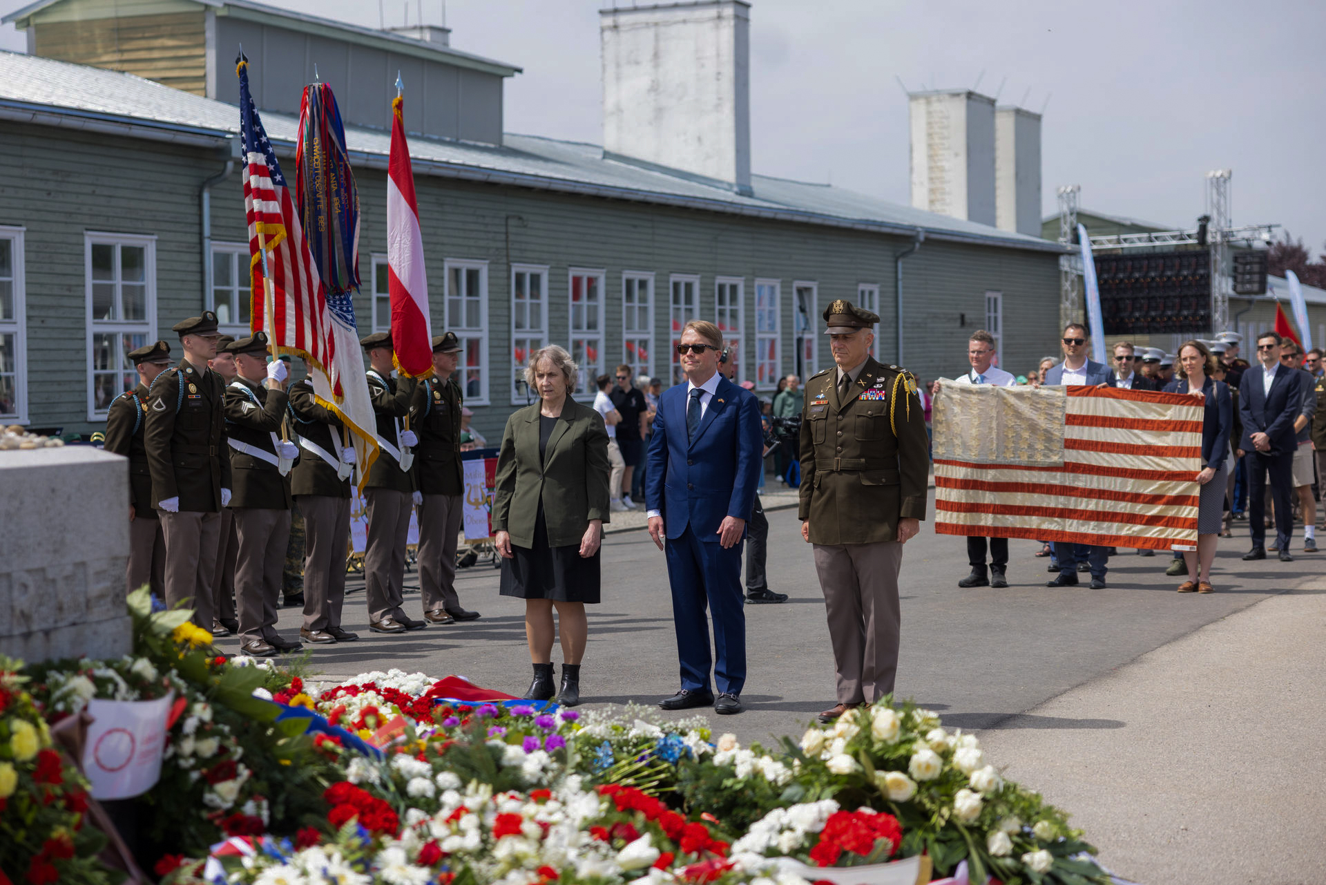 US delegation wreath laying at Mauthausen with Col. Drake, Ambassador Fisher, and Ellen Germain